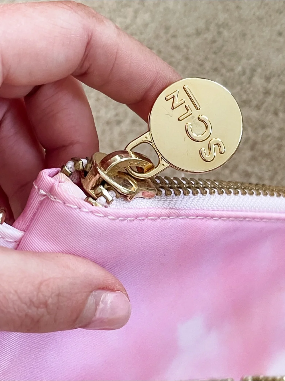 Stoney clover lane x target tie dye flat pouch with “STUFF” patches stuck on